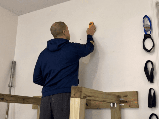 Using Stud Finder on Wall